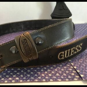 A unique vintage Guess leather belt -embroidered guess -metal stamped guess-used